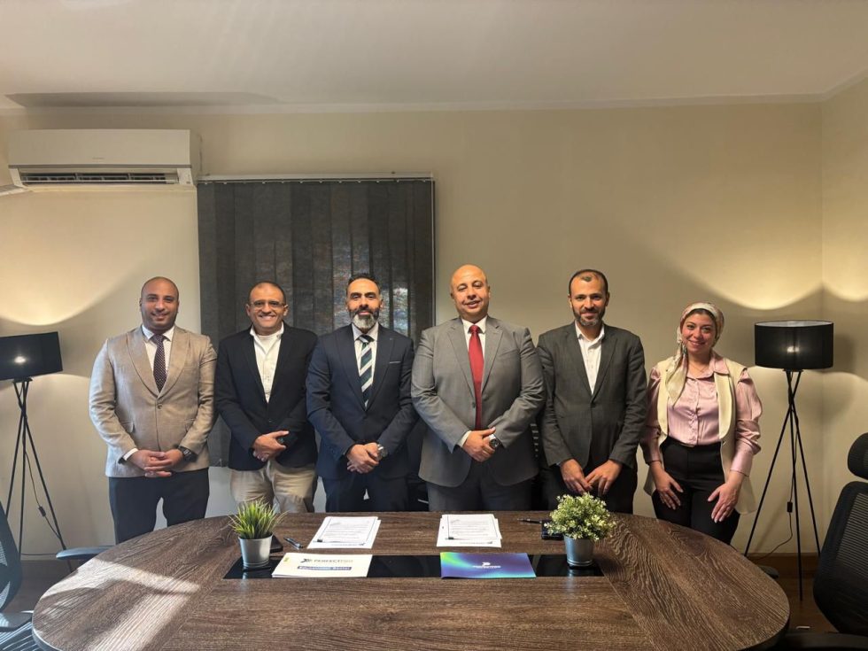 Facility Management Company Group of professionals at a signing, likely related to facility management ERP and CMMS systems.